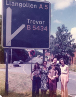 03/08/77 : A "social" stop showing the way to Trevor, also the name of the Mayor's chauffer on the way to the Royal National Eisteddfod.  Photograph, taken by Aubrey shows from left to right Janine (Aubrey's daughter, Mrs Morgan (Mayor's housekeeper), Dominic (Aubrey's son), Trevor (Mayor's chauffer) and Aubrey's wife Mary