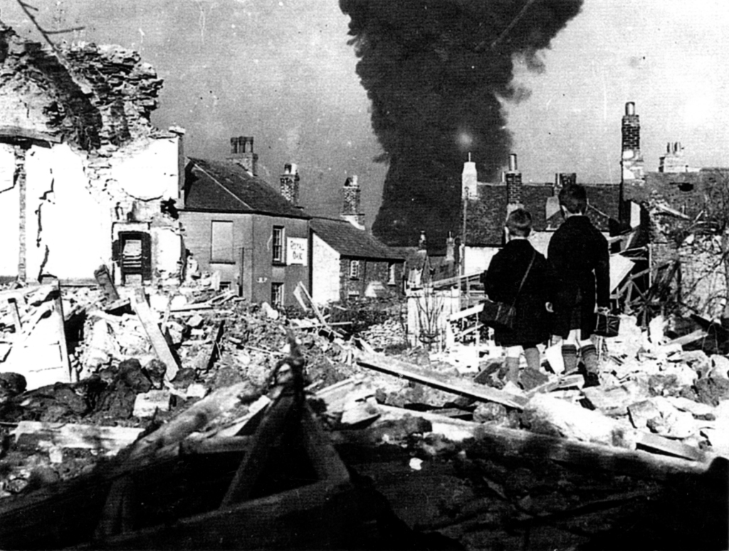 Fire at Turnchapel Oil Depot 27 November 1940, following a bombing raid.  Although this raid took place two weeks after Aubrey left Plymouth, it demonstrates the damage carried out in Plymouth during his time there